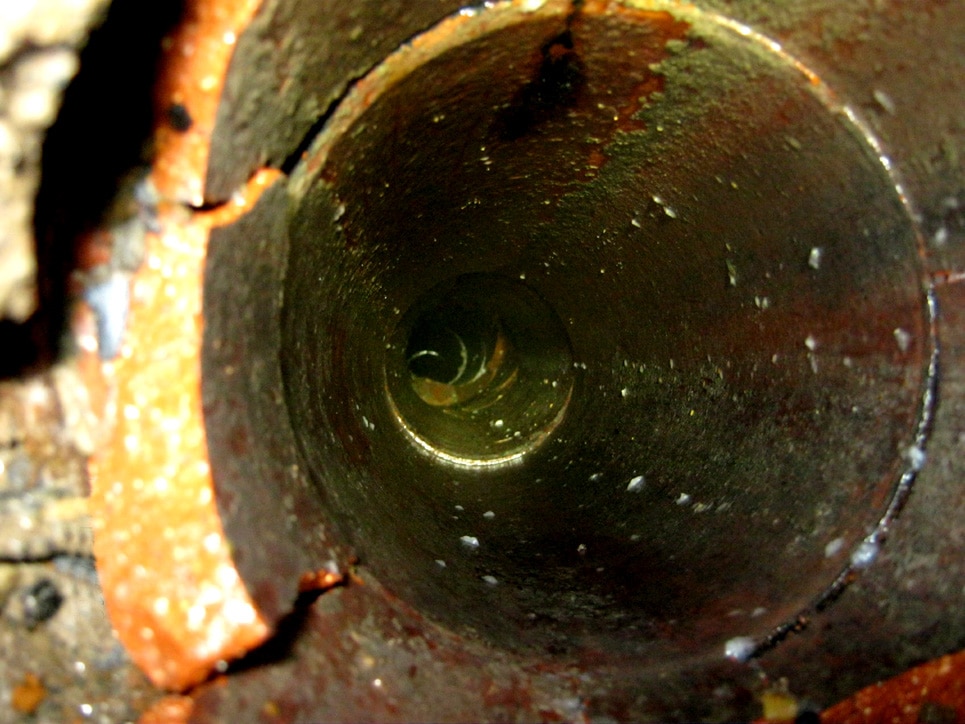 Inside of a clay sewer pipe.