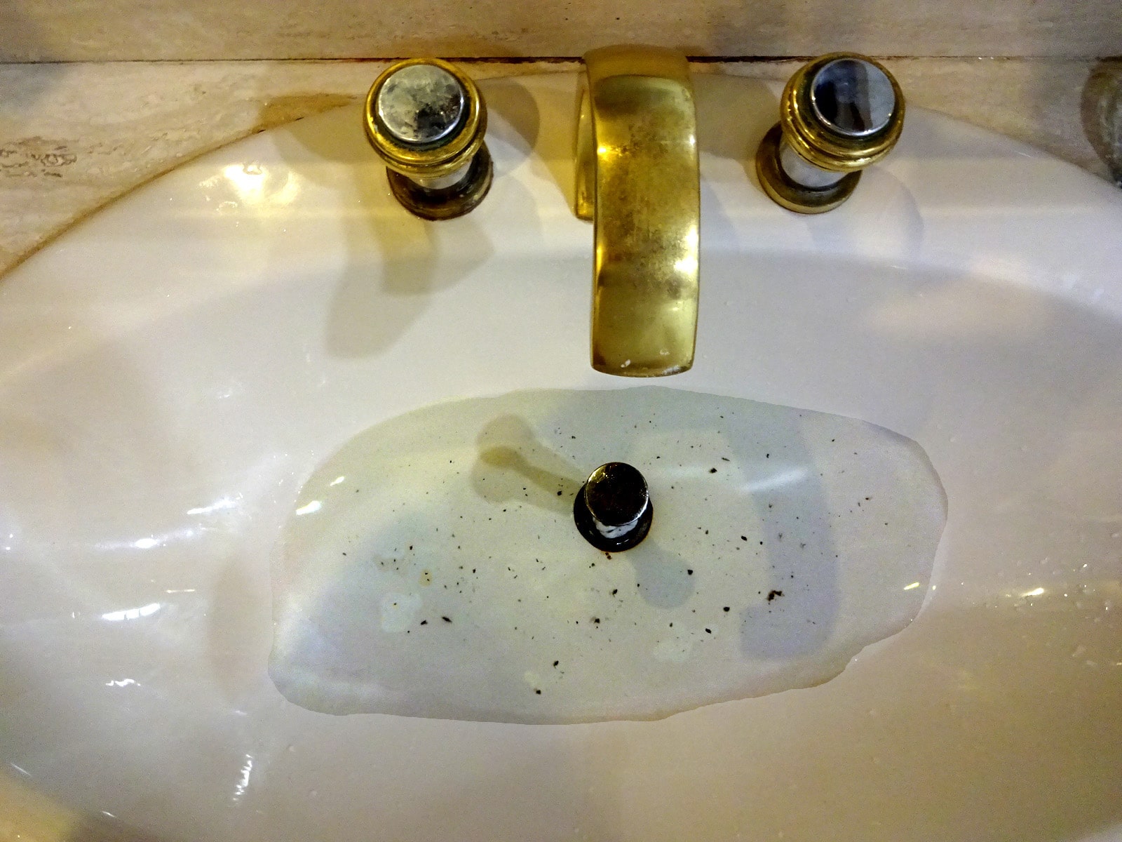 A clogged bathroom sink.