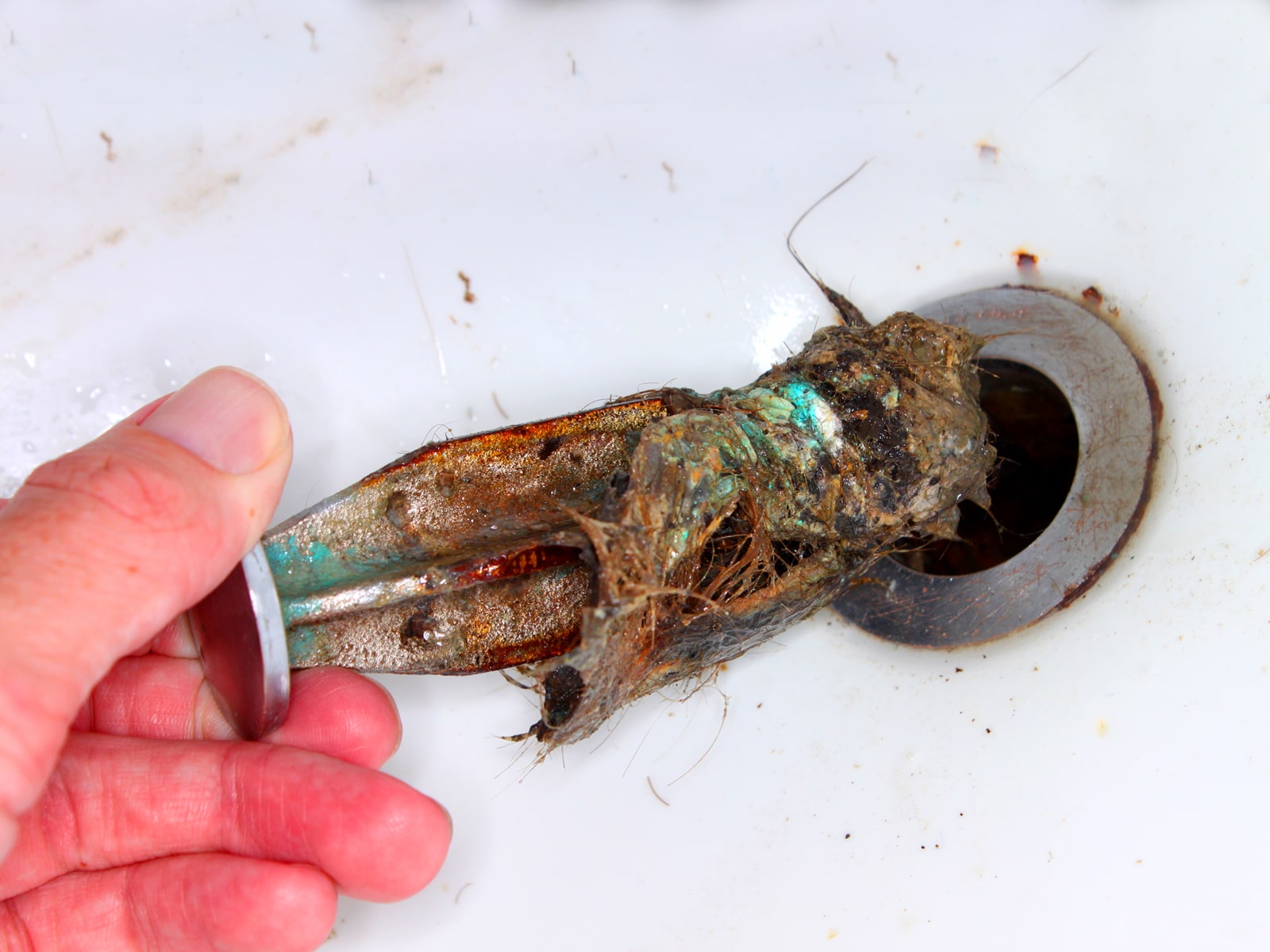 A clogged sink pop-up stopper.