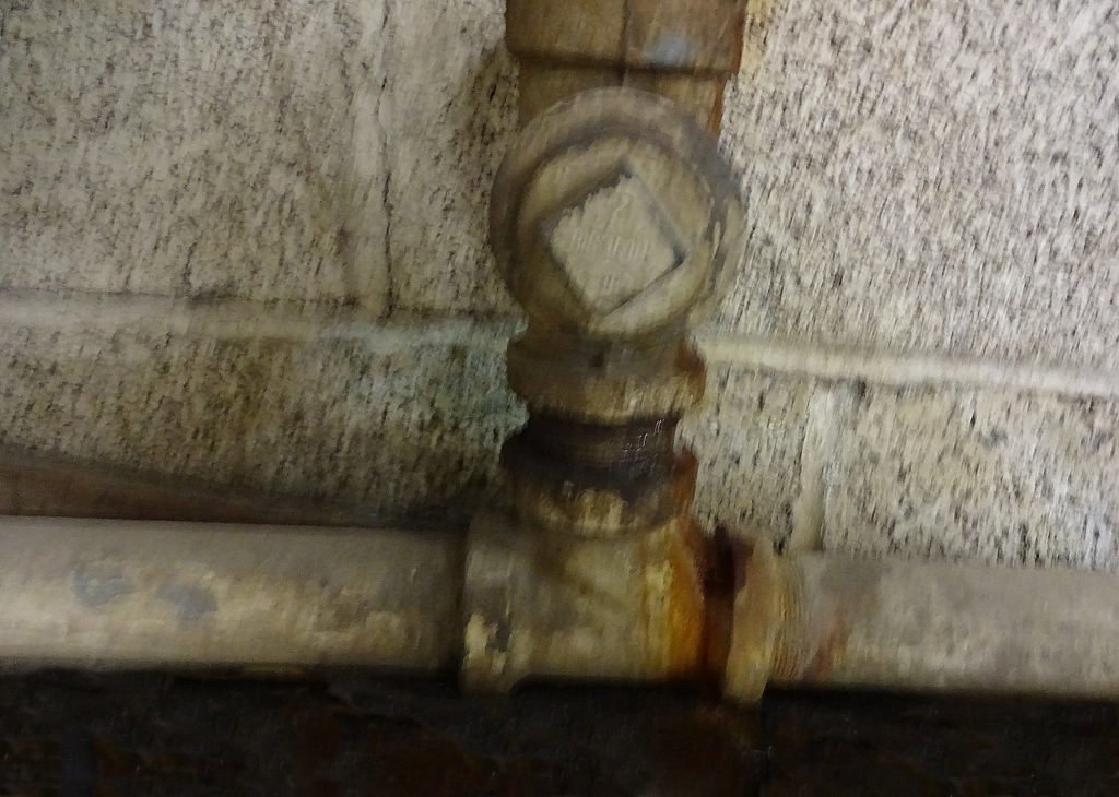 House stack sewer clean out cap as a threaded plug.
