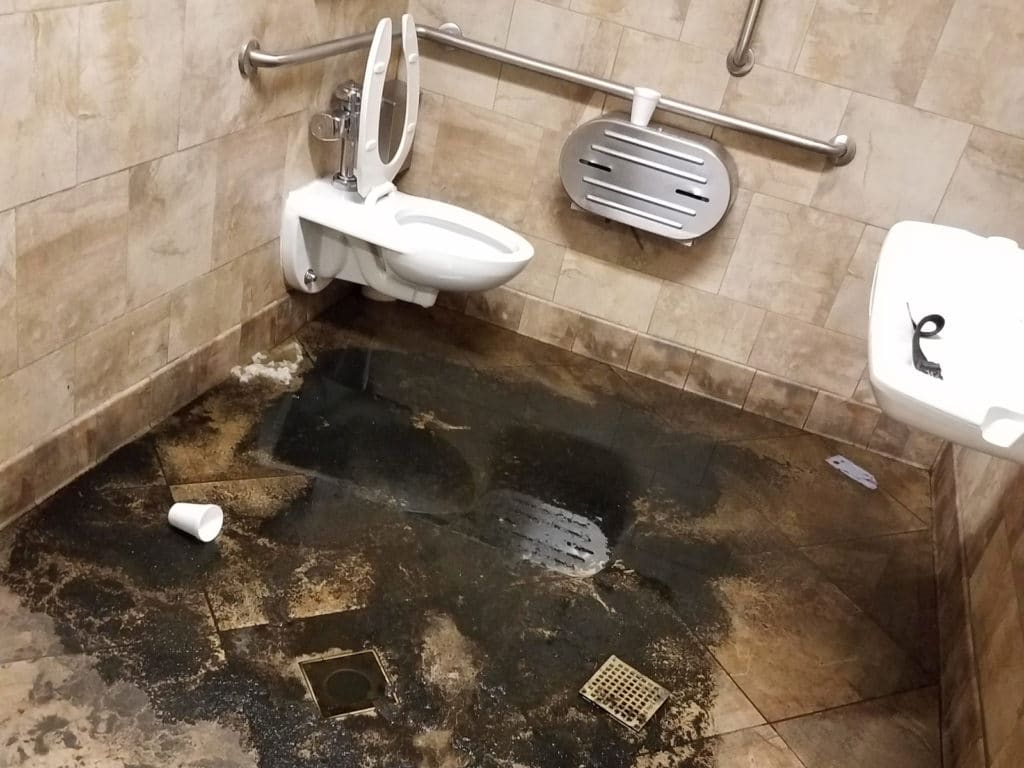 Floor drain clog in a bathroom.