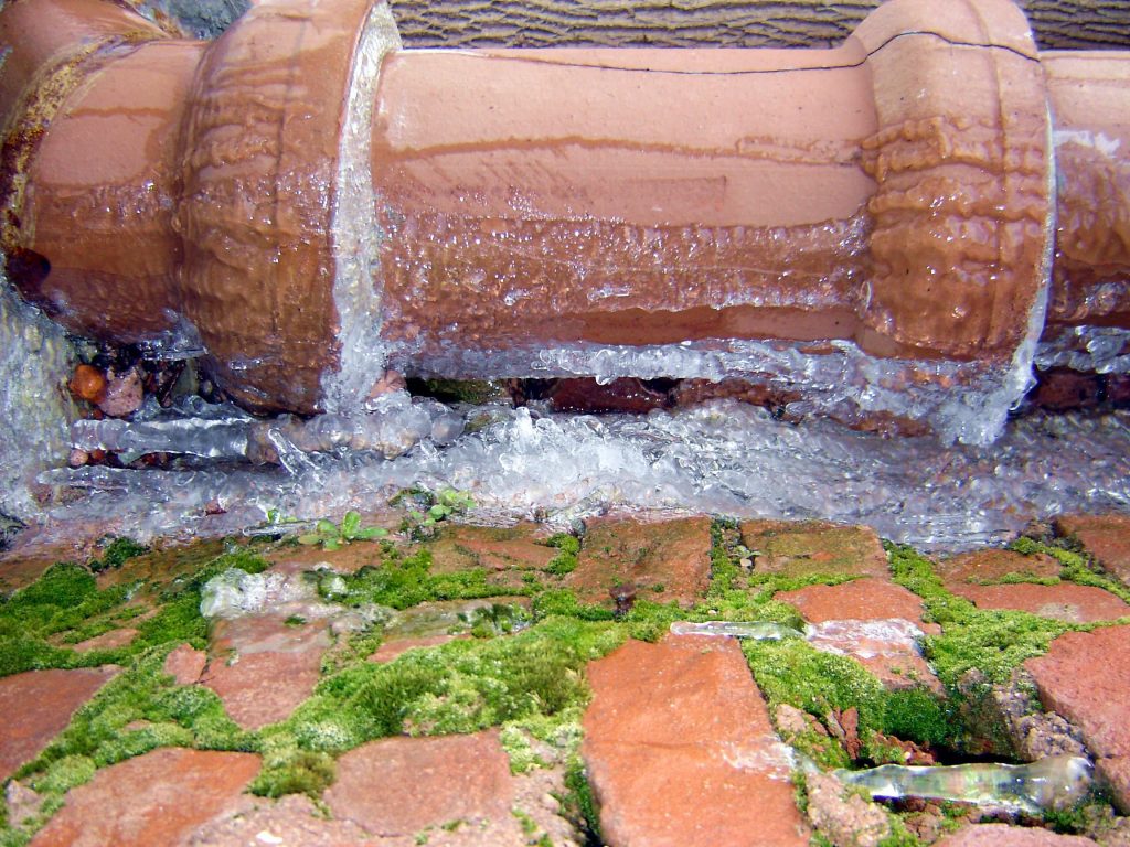 A frozen sewer pipe made from clay.