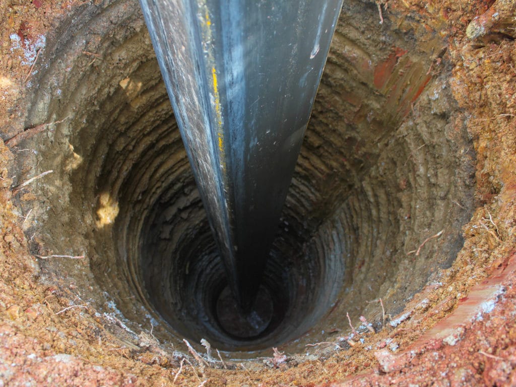 Drilling for a private drinking water well.